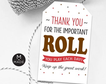 May include: White gift tag with red and brown polka dots. The tag says "Thank you for the important roll you play each day! Keep up the great work!"