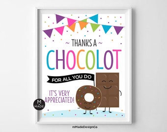 May include: A framed print with the words "Thanks a Chocolot" in colorful letters. The image features a smiling chocolate bar and donut, with confetti and a banner of colorful flags. The text "For all you do, it's very appreciated!" is also included.