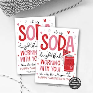 May include: Two Valentine's Day cards with the words "it is SODA" in red and pink. The cards have a cartoon soda can graphic and the text "lightful working with you!" and "Happy Valentine's Day!"