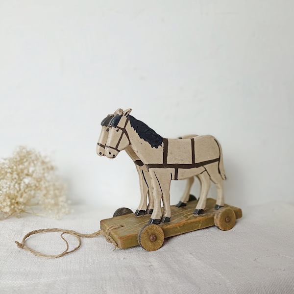 Ancient small pull-on animal horses made of wood wooden horses on wheels old antique antique toys children's toys shabby Brocante