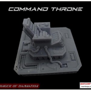 May include: A grey resin miniature of a Command Throne featuring a high-backed seat, control panels, and mechanical tubing on a square base. The text COMMAND THRONE, HARBINGER OF DAMNATION, and WATCORP DESIGNS - Small Designs, Big Ideas are visible.