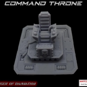 May include: A grey 3D printed miniature command throne featuring a high-backed seat, control panels with joysticks, and a skull emblem on the base. The text COMMAND THRONE and HARBINGER OF DAMNATION are visible, along with a WATCORP DESIGNS logo.