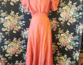 1930s, Red silk gown with puff sleeves
