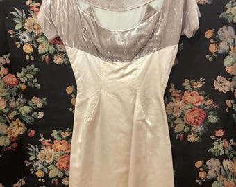 May include: A vintage dress with a white satin skirt and a grey velvet bodice. The bodice has a scoop neckline and short sleeves.