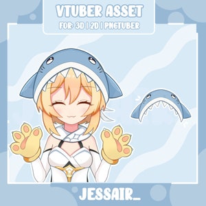 Puede incluir: Un personaje de dibujos animados con cabello rubio que lleva una sudadera con capucha de tiburón azul y guantes amarillos con forma de pata. El personaje sonríe y tiene una expresión feliz. La imagen también incluye una cabeza de tiburón azul separada con dientes.