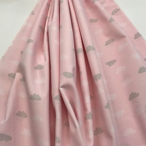May include: Pink fabric with a white and gray cloud pattern. The clouds have raindrops falling from them.