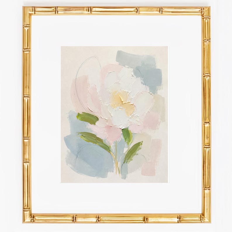 May include: A framed painting featuring an abstract floral subject with thick, textured brushstrokes in shades of white, pale pink, soft yellow, and muted blue-green, set within a metallic gold frame with a decorative bamboo-style texture.