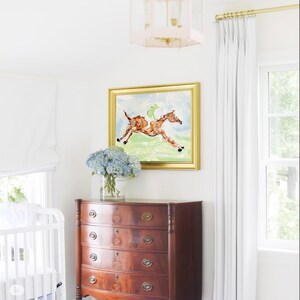 A room corner featuring a dark wooden chest of drawers, a vase of hydrangeas, and a framed horse painting on the wall.
