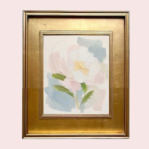 May include: An oil painting on canvas featuring an abstract floral motif in soft pastel shades of pink, white, yellow, and sage green, set within a wide, ornate gold-toned frame with a smooth, reflective finish and a rectangular border design.