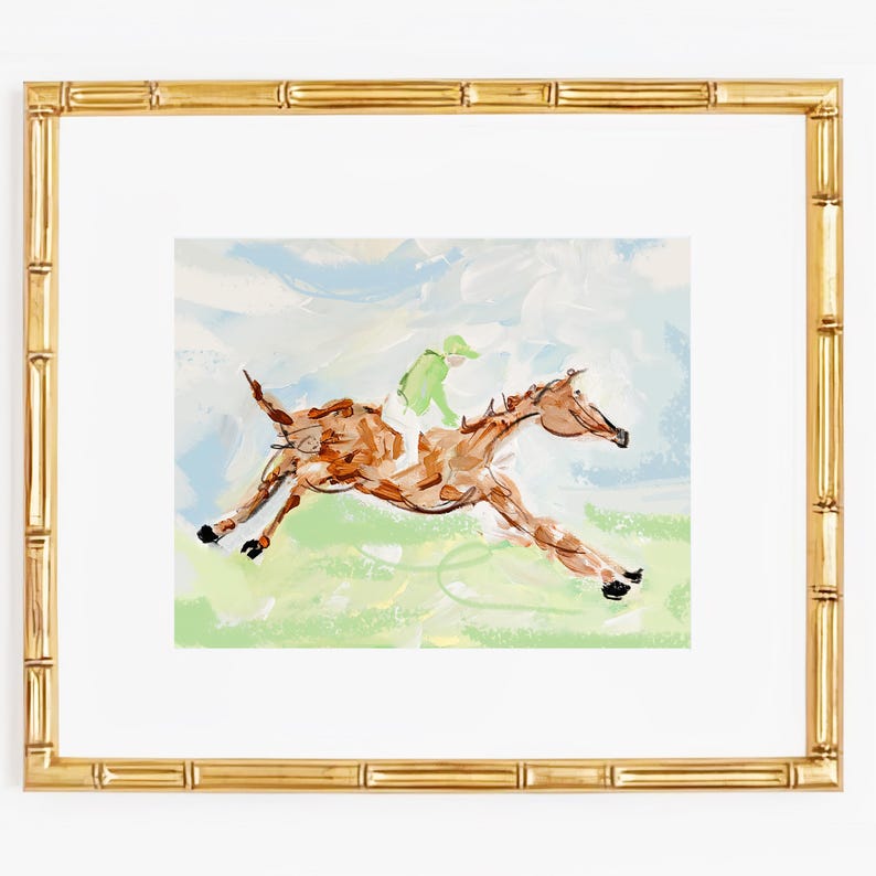 An impressionist painting of a brown horse and jockey in a bamboo-style gold frame against a white background.