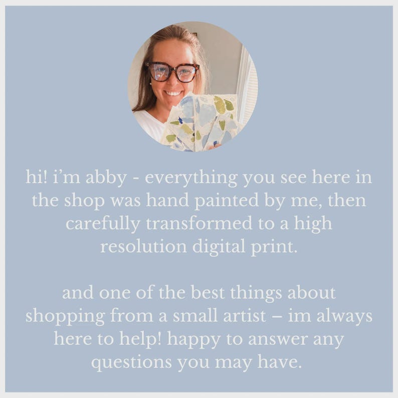 May include: A circular portrait of a person with brown hair and glasses holding several sheets of paper with blue and green abstract painted patterns. The text reads: hi! i&rsquo;m abby - everything you see here in the shop was hand painted by me.