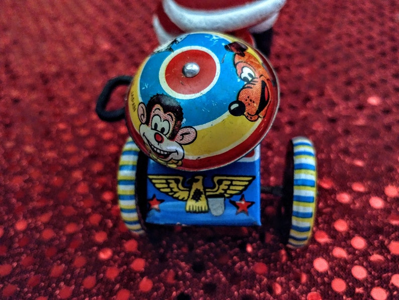 Vintage Tin Wind Up Santa Claus Riding Tricycle