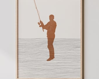 May include: A minimalist illustration of a person fishing, printed on a framed poster with a white background and brown lines. The poster is hanging on a white wall above a wooden cabinet with a woven rattan door.