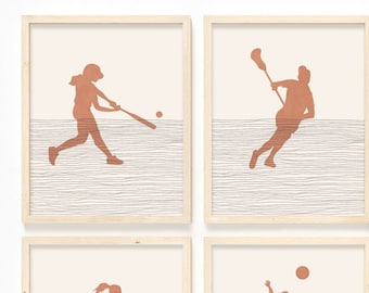 May include: Set of four framed prints featuring silhouettes of athletes playing different sports. Each print has a light brown background with a white woodgrain pattern and a light brown frame.