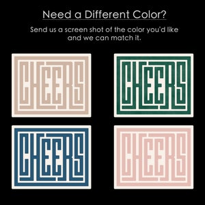 May include: Four square coasters with the word "CHEERS" written in a maze-like pattern. The coasters are in four different colors: beige, green, blue, and pink.