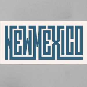 May include: A rectangular sticker with the word "NEW MEXICO" in a stylized, geometric font. The letters are a deep teal color against a cream-colored background. The sticker is rectangular and has a clean, modern design.