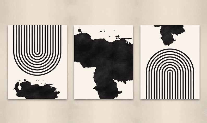 May include: Set of three black and white abstract art prints. Each print features a black and white geometric design with a black watercolor shape in the background.