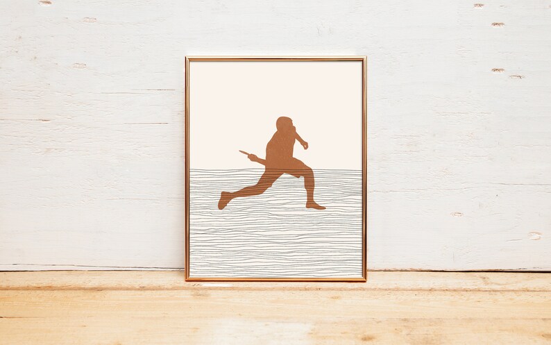 May include: Framed art print featuring a brown silhouette of a person running with a racket. The artwork has a minimalist design with a light peach background and a textured, horizontal line pattern.