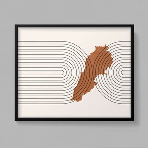 May include: A minimalist art print featuring a brown outline of Lebanon against a background of black and white concentric circles.