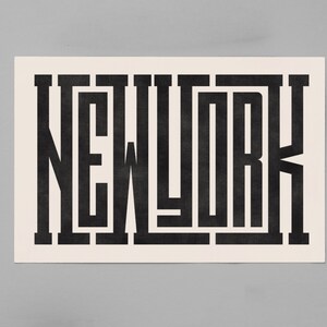 May include: Black and white graphic design of the word "NEW YORK" in a bold, geometric font.