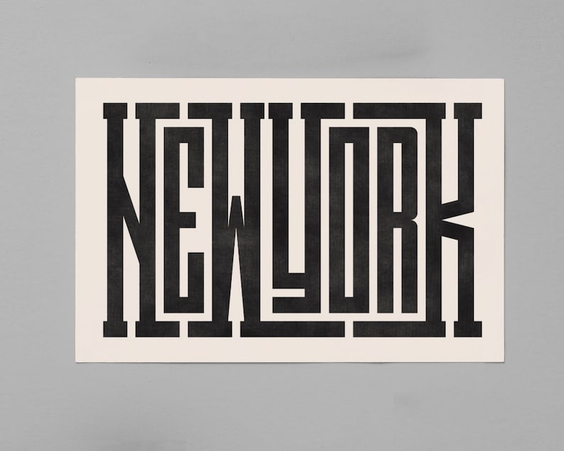 May include: Black and white graphic design of the word "NEW YORK" in a bold, geometric font.