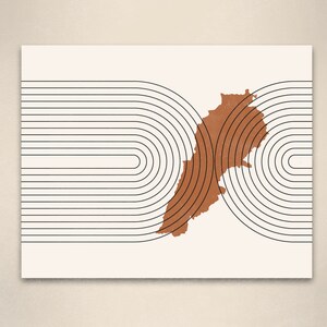 May include: An abstract geometric print featuring a brown outline of Lebanon against a white background with black concentric circles.