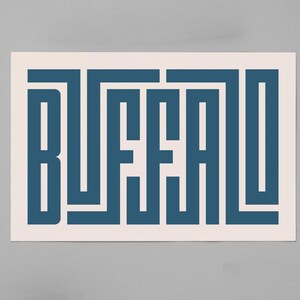 May include: A white card with the word "BUFFALO" written in a blue, geometric font.