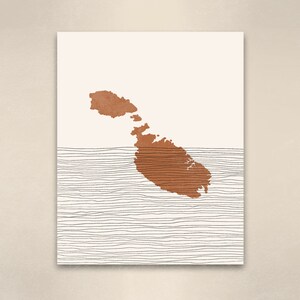 May include: A minimalist art print featuring a brown outline of the island of Malta on a white background with black lines representing the sea.