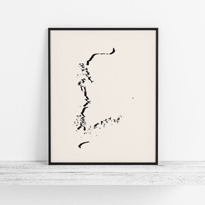 May include: Black and white abstract art print in a black frame. The print features a stylized design of a tree or a plant with branches and leaves.