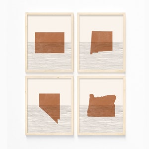 May include: Set of four minimalist art prints featuring the outlines of four US states in a burnt orange color. Each state is set against a background of white and gray horizontal lines, suggesting a horizon or water.