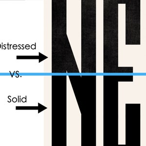 May include: A comparison of two styles of the word "NEW" in black text. The top word has a distressed, textured look, while the bottom word is solid black.