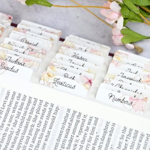 Bible tabs with floral images and a cursive font.