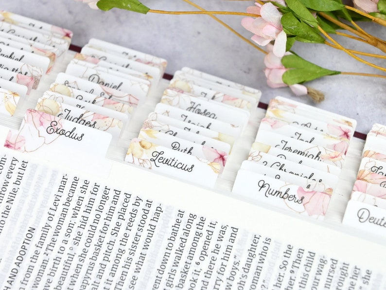 Bible tabs with floral images and a cursive font.