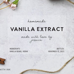 May include: A clear label with the words "VANILLA EXTRACT" in bold black letters. The label also includes the words "homemade", "made with love by jessica", and the ingredients "VANILLA BEANS, VODKA". The bottling date is November 12, 2023.