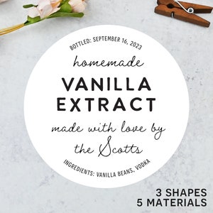 May include: A white circular label with black text that reads "homemade VANILLA EXTRACT" with the text "made with love by the Scotts." The label also includes the ingredients and the date bottled.
