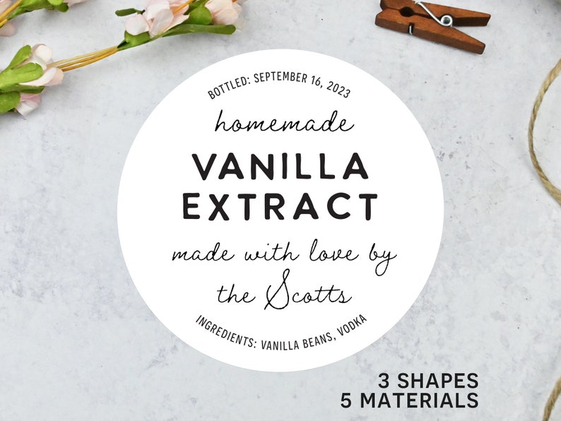 May include: A white circular label with black text that reads "homemade VANILLA EXTRACT" with the text "made with love by the Scotts." The label also includes the ingredients and the date bottled.