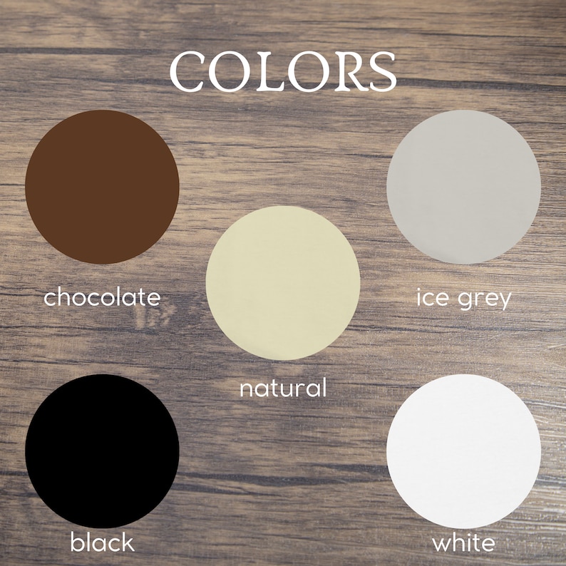 May include: Color chart with six round paint chips showing the colors: chocolate, natural, ice grey, black, and white. The word "COLORS" is written above the paint chips.