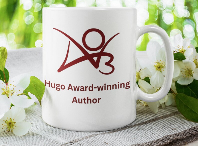 K&ouml;nnte beinhalten: Eine wei&szlig;e Keramiktasse mit einem roten Logo und dem Text "Hugo Award-winning Author".