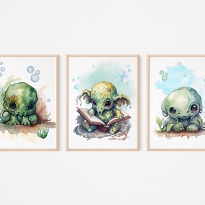 May include: Three watercolor paintings of cute, green, cartoon creatures with large eyes. The first creature is sitting with its hands on its chin. The second creature is reading a book. The third creature is sitting with its hands on its knees.