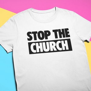 May include: White t-shirt with the text "STOP THE CHURCH" printed in black.
