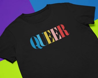 May include: Black t-shirt with the word "QUEER" printed in rainbow colors.