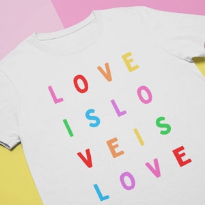 LOVE IS LOVE Rainbow Shirt | Gay Power Lgbtq Typography Colorful Queer Wear Pride Parade Outfit | Short-Sleeve Unisex T-Shirt