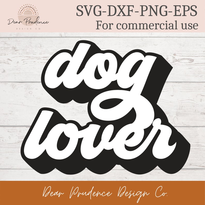 May include: A black and white graphic design with the words "dog lover" in a bold, stylized font. The design includes the text "SVG-DXF-PNG-EPS For commercial use" and the logo "Dear Prudence Design Co."