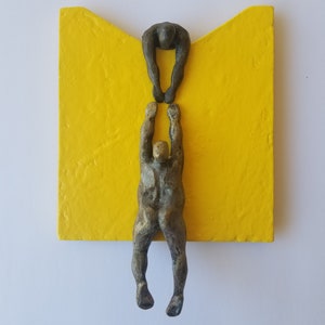 Wall figurine helping a climber, wavy base, original sculpture, by Diaz art, mixed media, wall mounted art limited edition, modern art Yellow