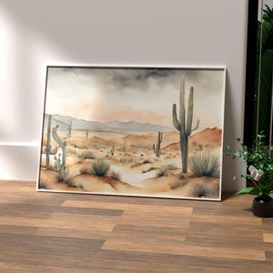 In the heart of a vibrant office space, surrounded by green elements like palm and faux plants, the beautiful watercolor desert landscape artwork brings nature indoors