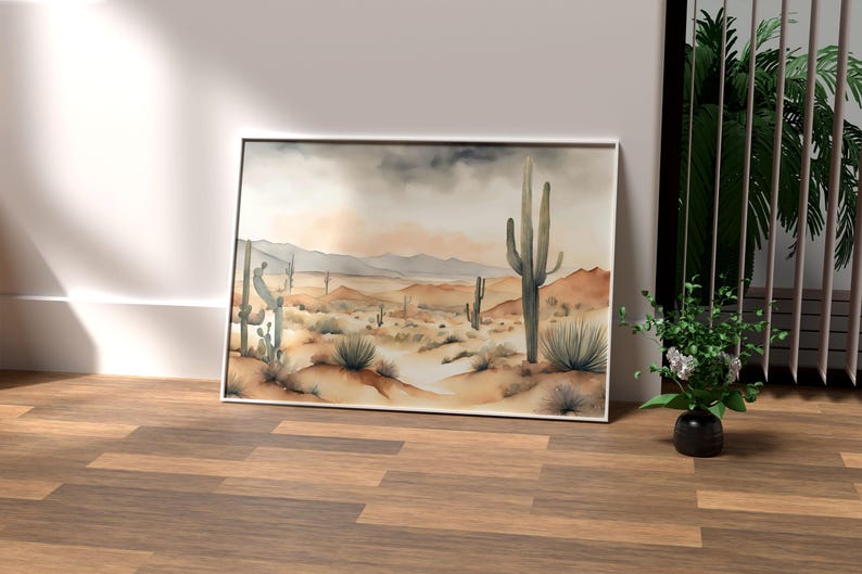 In the heart of a vibrant office space, surrounded by green elements like palm and faux plants, the beautiful watercolor desert landscape artwork brings nature indoors