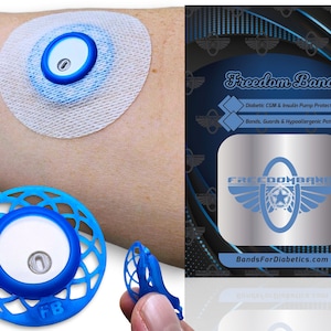 May include: A blue and white Freedom Band for diabetic CGM and insulin pump protection. The band is designed to help secure the device to the skin and prevent it from being snagged or pulled. The band is made of a soft, comfortable material and is hypoallergenic. The text "FREEDOMBAND" and "BandsForDiabetics.com" are visible on the packaging.