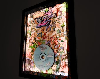 Marvel vs. Capcom 2: New Age of Heroes Replica CD Deluxe Shadow Box Framed Art (Select a Size) (Choose a Background) (Optional Lighting)
