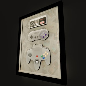 Nintendo Controller Evolution Deluxe Shadow Box Framed Art (Select a Size) (Choose a Background) (Optional Lighting)