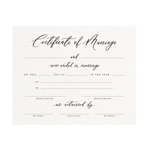 May include: A blank certificate of marriage with lines for the bride and groom's names, the date, and the officiant's name. The text "Certificate of Marriage" is written in cursive at the top of the document.